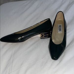 Green patent leather shoes with gold horse bit detail